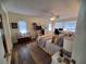 Spacious main bedroom with a comfortable bed and plenty of light at 1707 New Bedford Dr, Sun City Center, FL 33573