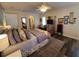 Main bedroom with king bed, and decorative elements at 1707 New Bedford Dr, Sun City Center, FL 33573
