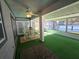 Relaxing screened porch with green carpet and dining set at 1707 New Bedford Dr, Sun City Center, FL 33573