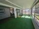 Bright and airy screened porch with outdoor dining set at 1707 New Bedford Dr, Sun City Center, FL 33573