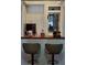 Wet bar with wood countertop, wine cooler, and liquor storage at 1707 New Bedford Dr, Sun City Center, FL 33573
