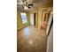 Well-lit bedroom with tile floors, closet, and access to hallway at 2525 Turkey Creek Rd, Plant City, FL 33566