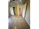 Bedroom with tile floors, double door closet and hallway access at 2525 Turkey Creek Rd, Plant City, FL 33566