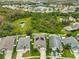 Aerial view of house with solar panels and neighborhood at 30445 Tremont Dr, Wesley Chapel, FL 33543