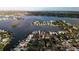 Aerial view showing a house on a canal with water access and neighboring houses at 405 16Th Ave, Indian Rocks Beach, FL 33785