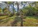Backyard with lush vegetation and wooden fence at 4290 Yucatan Cir, Port Charlotte, FL 33948