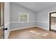 Charming bedroom with hardwood floors and access to a screened porch at 4290 Yucatan Cir, Port Charlotte, FL 33948