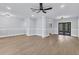 Bright living room with wood-look floors and modern light fixtures at 4290 Yucatan Cir, Port Charlotte, FL 33948