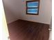 Simple bedroom with hardwood floors at 9744 Lake Seminole E Dr, Largo, FL 33773