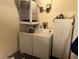 Laundry room with washer, dryer, and storage cabinet at 9744 Lake Seminole E Dr, Largo, FL 33773
