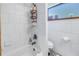 Clean bathroom with white tile, bathtub, and shower at 3401 60Th N St, St Petersburg, FL 33710