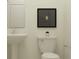 Simple bathroom with pedestal sink and toilet at 11658 E 74Th Cir, Palmetto, FL 34221