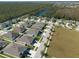 Aerial view of a residential neighborhood near a lake at 12512 Brick Cobblestone Dr, Riverview, FL 33579