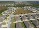 Aerial view of a neighborhood with a large empty lot at 12512 Brick Cobblestone Dr, Riverview, FL 33579