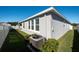 View of the backyard, showcasing the home's exterior and landscaping at 12512 Brick Cobblestone Dr, Riverview, FL 33579