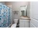 Clean bathroom with a shower/tub combo and vanity with granite top at 12512 Brick Cobblestone Dr, Riverview, FL 33579