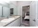Double vanity bathroom with view of bedroom at 12512 Brick Cobblestone Dr, Riverview, FL 33579