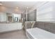 Spacious bathroom with double vanity, soaking tub, and walk-in shower at 12512 Brick Cobblestone Dr, Riverview, FL 33579