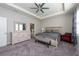 Spacious Primary bedroom with dresser and seating area at 12512 Brick Cobblestone Dr, Riverview, FL 33579