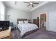 Comfortable bedroom with a queen bed, built-in desk, and en-suite bathroom at 12512 Brick Cobblestone Dr, Riverview, FL 33579