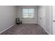 Well-lit bedroom with a chair and double door closet at 12512 Brick Cobblestone Dr, Riverview, FL 33579
