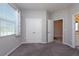 Spacious bedroom with a double door closet and access to another room at 12512 Brick Cobblestone Dr, Riverview, FL 33579