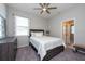 Bedroom with striped bedding and ceiling fan at 12512 Brick Cobblestone Dr, Riverview, FL 33579