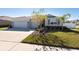 Two-story house with three-car garage and stone accents at 12512 Brick Cobblestone Dr, Riverview, FL 33579