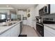 Bright kitchen with stainless steel appliances and granite countertops at 12512 Brick Cobblestone Dr, Riverview, FL 33579