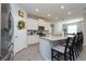 Modern kitchen with white cabinets and granite countertops at 12512 Brick Cobblestone Dr, Riverview, FL 33579