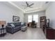 Bright living room featuring comfortable seating and a home office area at 12512 Brick Cobblestone Dr, Riverview, FL 33579