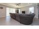 Living room with sectional sofa and access to the backyard at 12512 Brick Cobblestone Dr, Riverview, FL 33579