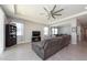 Open-concept living room with sectional sofa and fireplace at 12512 Brick Cobblestone Dr, Riverview, FL 33579
