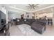 Spacious living room featuring a sectional sofa and large TV at 12512 Brick Cobblestone Dr, Riverview, FL 33579