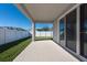 Covered patio with sliding glass doors and backyard view at 12512 Brick Cobblestone Dr, Riverview, FL 33579