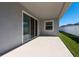 Covered patio with sliding glass doors at 12512 Brick Cobblestone Dr, Riverview, FL 33579