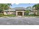 Community clubhouse with welcoming entrance and landscaping at 13685 Newbridge St, Spring Hill, FL 34609