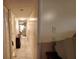 A long hallway with tile floors and doors leading to other rooms at 138 Hunter Lake Dr # F, Oldsmar, FL 34677