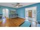 Living room with hardwood floors, blue walls and access to sunroom at 1517 10Th N Ave, St Petersburg, FL 33705