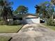 House exterior with white garage door and landscaping at 1944 South Carolina Ne Ave, St Petersburg, FL 33702