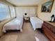 Guest bedroom with two twin beds and plenty of light at 2331 Belleair Rd # 611, Clearwater, FL 33764