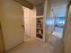 Bright hallway with built-in shelving and access to other rooms at 2331 Belleair Rd # 611, Clearwater, FL 33764