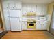 Retro yellow oven and white appliances in this bright kitchen at 2331 Belleair Rd # 611, Clearwater, FL 33764