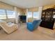 Relaxing living room with comfortable seating and a large TV for entertainment at 2331 Belleair Rd # 611, Clearwater, FL 33764
