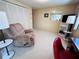 Cozy living room with a recliner and built in shelving at 2331 Belleair Rd # 611, Clearwater, FL 33764