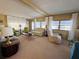 Spacious living room with neutral carpeting and comfortable seating at 2331 Belleair Rd # 611, Clearwater, FL 33764