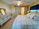 Main bedroom with a king-size bed and ensuite bathroom at 2331 Belleair Rd # 611, Clearwater, FL 33764