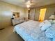 Main bedroom with a king-size bed, dresser, and access to a private bathroom at 2331 Belleair Rd # 611, Clearwater, FL 33764