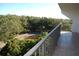 Private balcony overlooking lush green landscape at 2699 Seville Blvd # 605, Clearwater, FL 33764
