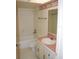 Bathroom with tub, toilet and single sink vanity at 2699 Seville Blvd # 605, Clearwater, FL 33764